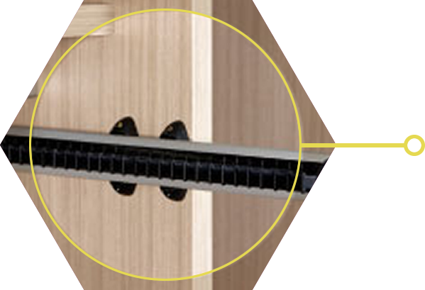 Detail image of a tie rack in a light coloured wood wardrobe